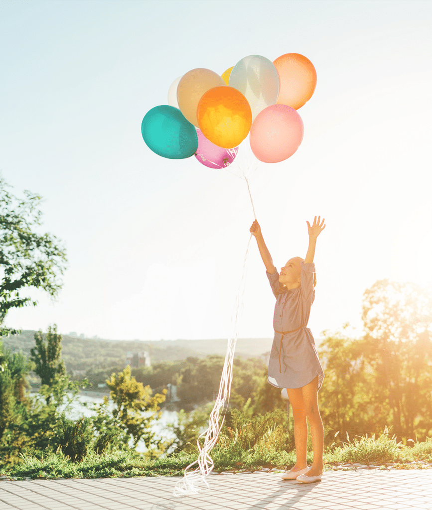 little girl with balloons